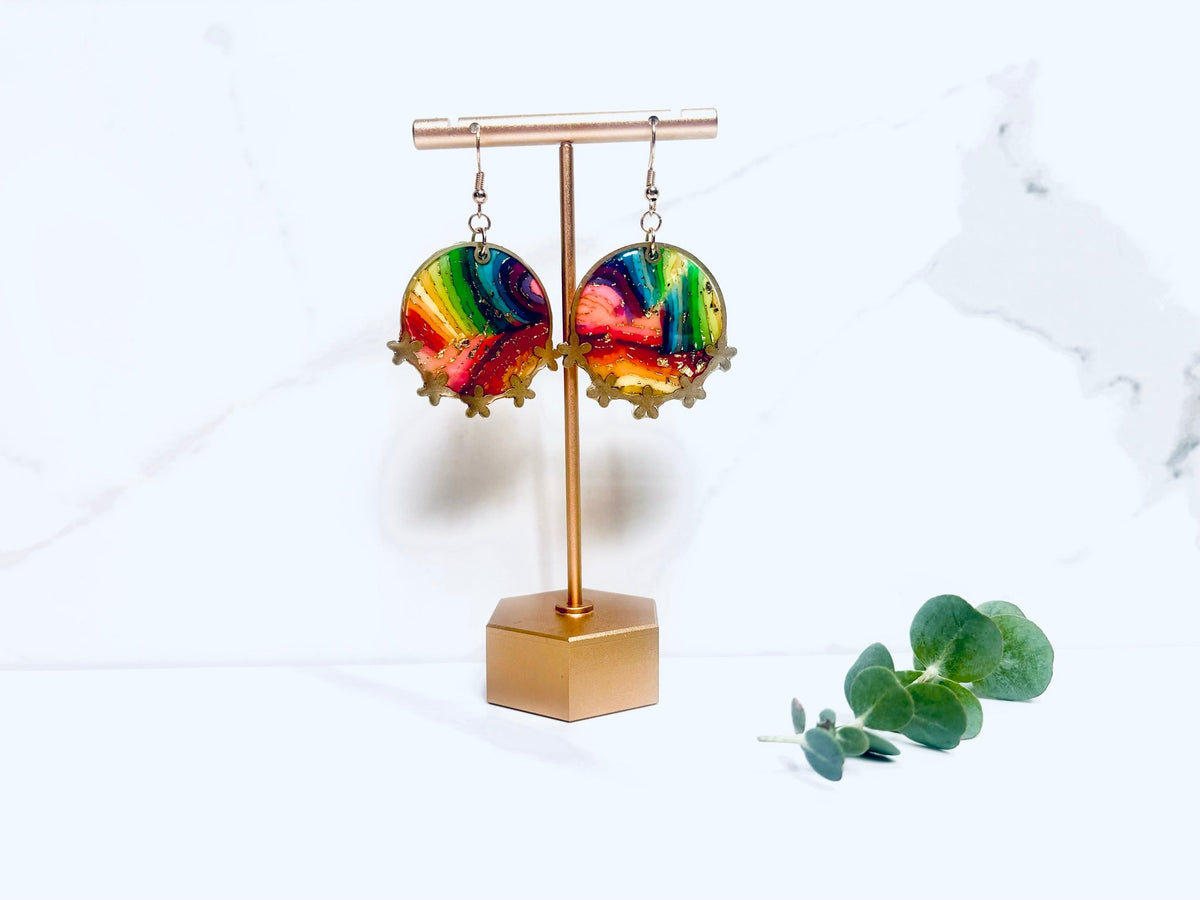 Rainbow bezel earrings detail on display stand