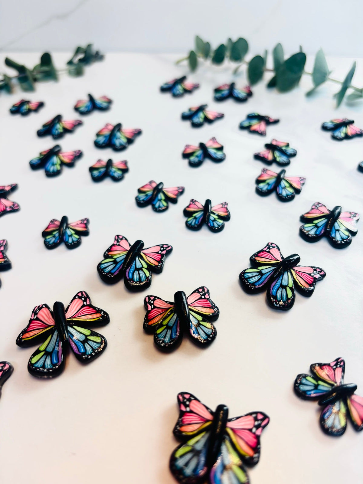 A flock of handmade rainbow butterflies
