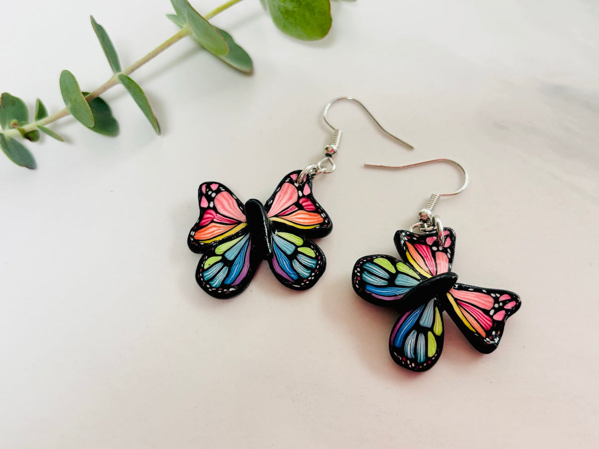 Butterfly earrings on a marble background